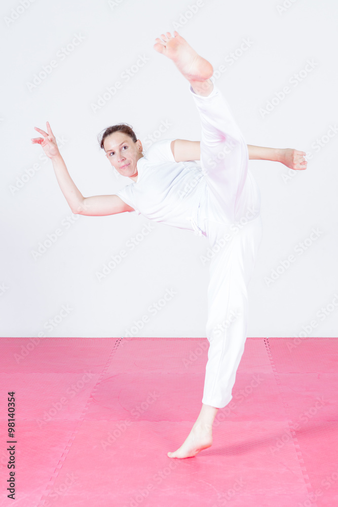 Young woman dancing capoeira Young woman dancing capoeira