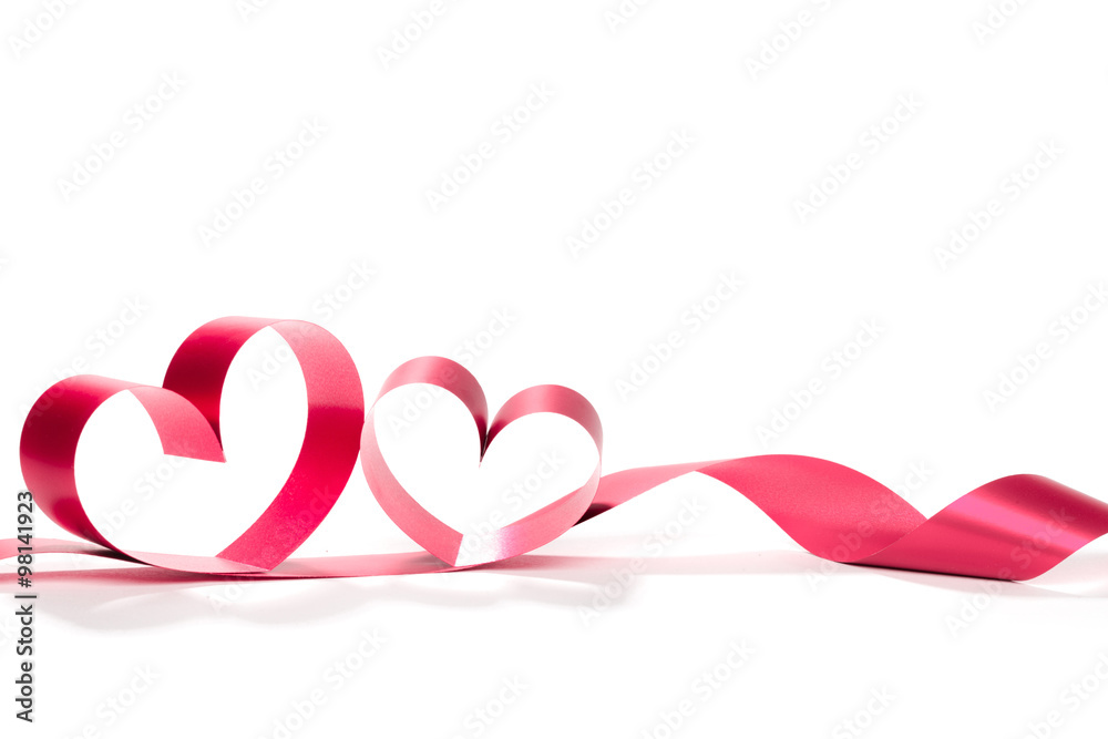 Ribbons shaped as hearts on white