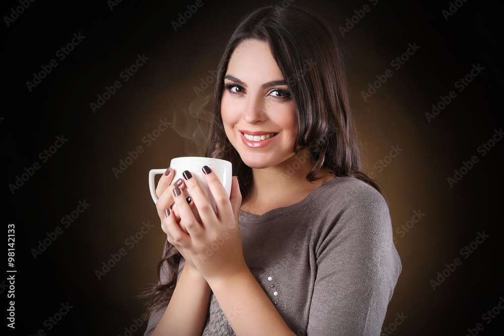 Portrait of smiling pretty woman with cup of coffee Portrait of smiling pretty woman with cup of coffee