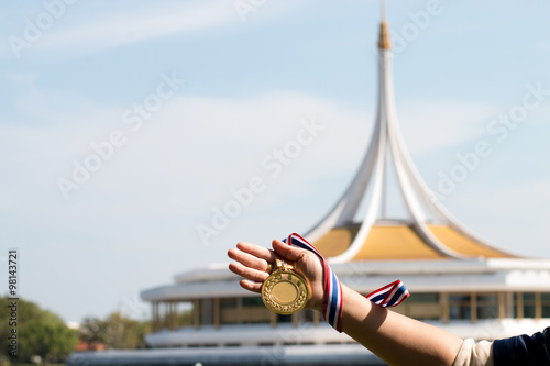 old gold medal in hand the winner on bangkok thailand park photo