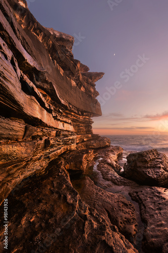 Rocky seascape with Moon