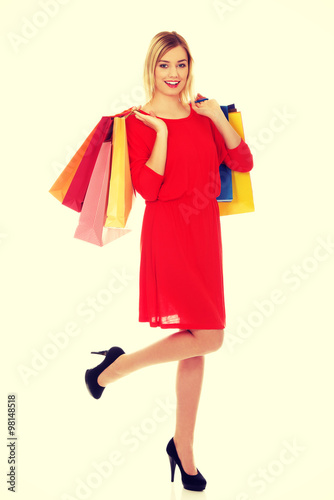 Woman with a lot of shopping bags.