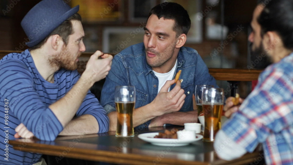 happy male friends drinking beer at bar or pub happy male friends drinking beer at bar or pub