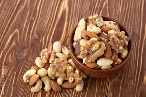 Mix nuts on wooden background