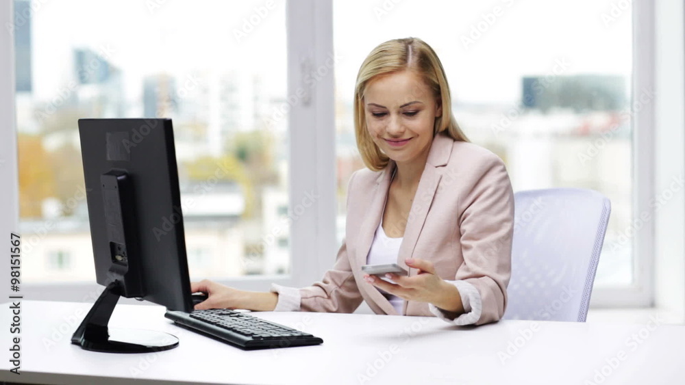 smiling businesswoman with computer and smartphone smiling businesswoman with computer and smartphone