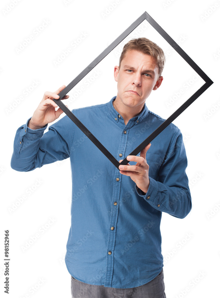 happy young-man holding a black frame happy young-man holding a black frame