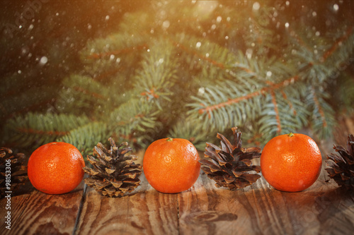 Christmas New Year composition with Tangerines and Pine cones o