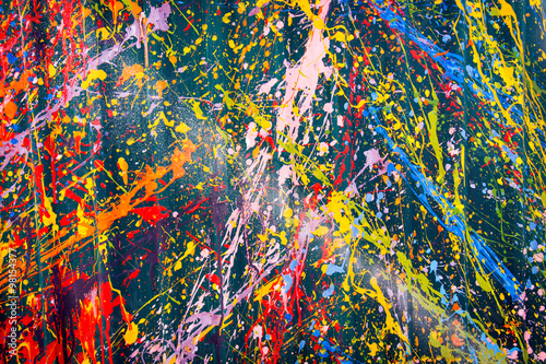 Abstract, Colorful Paint Splash on a green background.