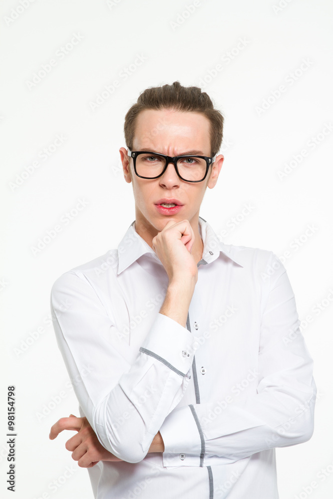 Serious businessman in glasses looking at camera