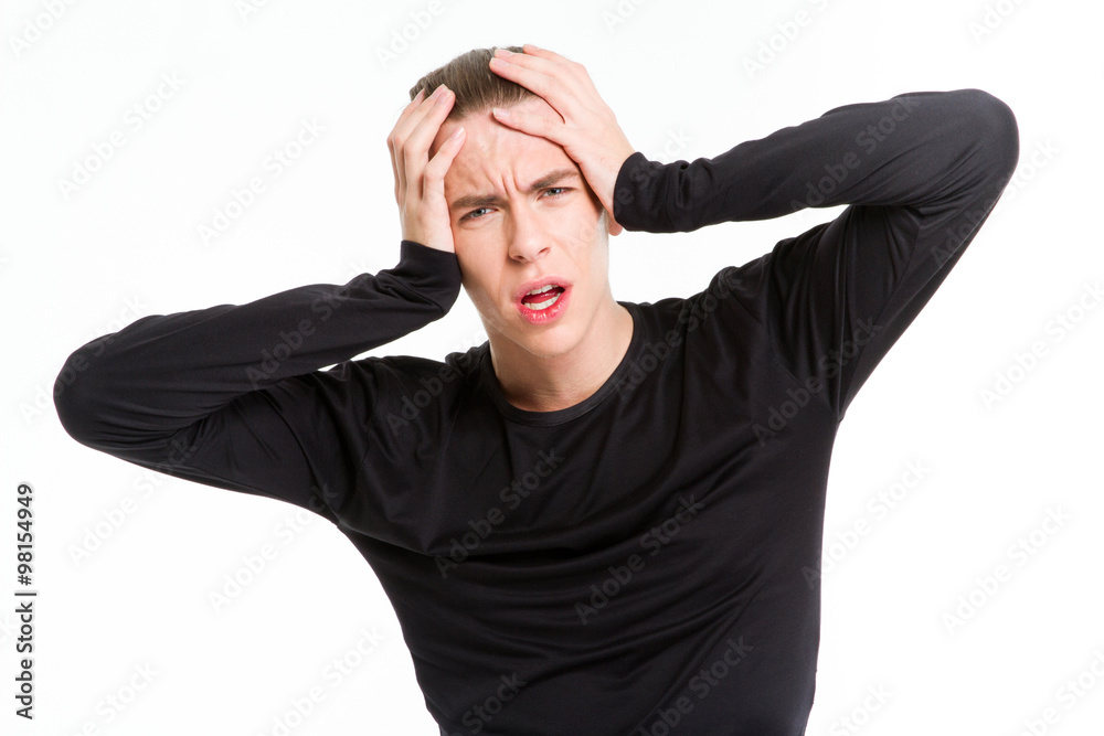 Portrait of a stressed man touching his head