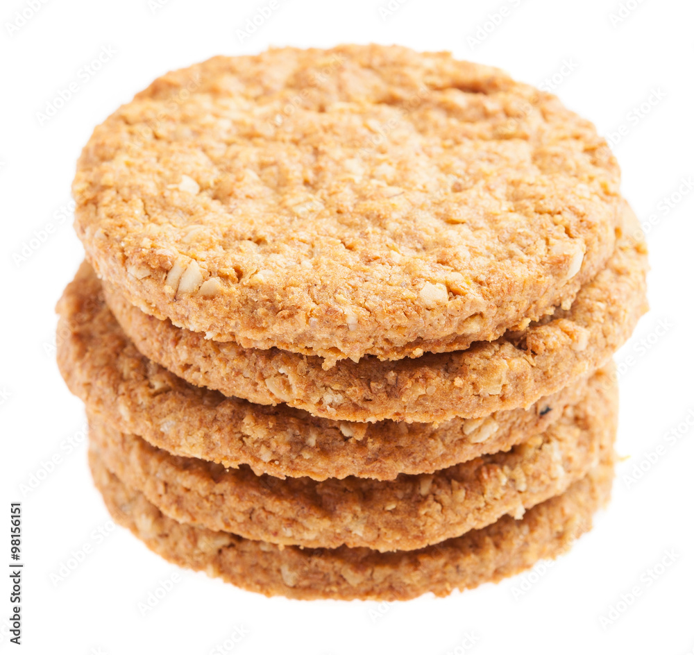 a pile of oats biscuits on a white background a pile of oats biscuits on a white background