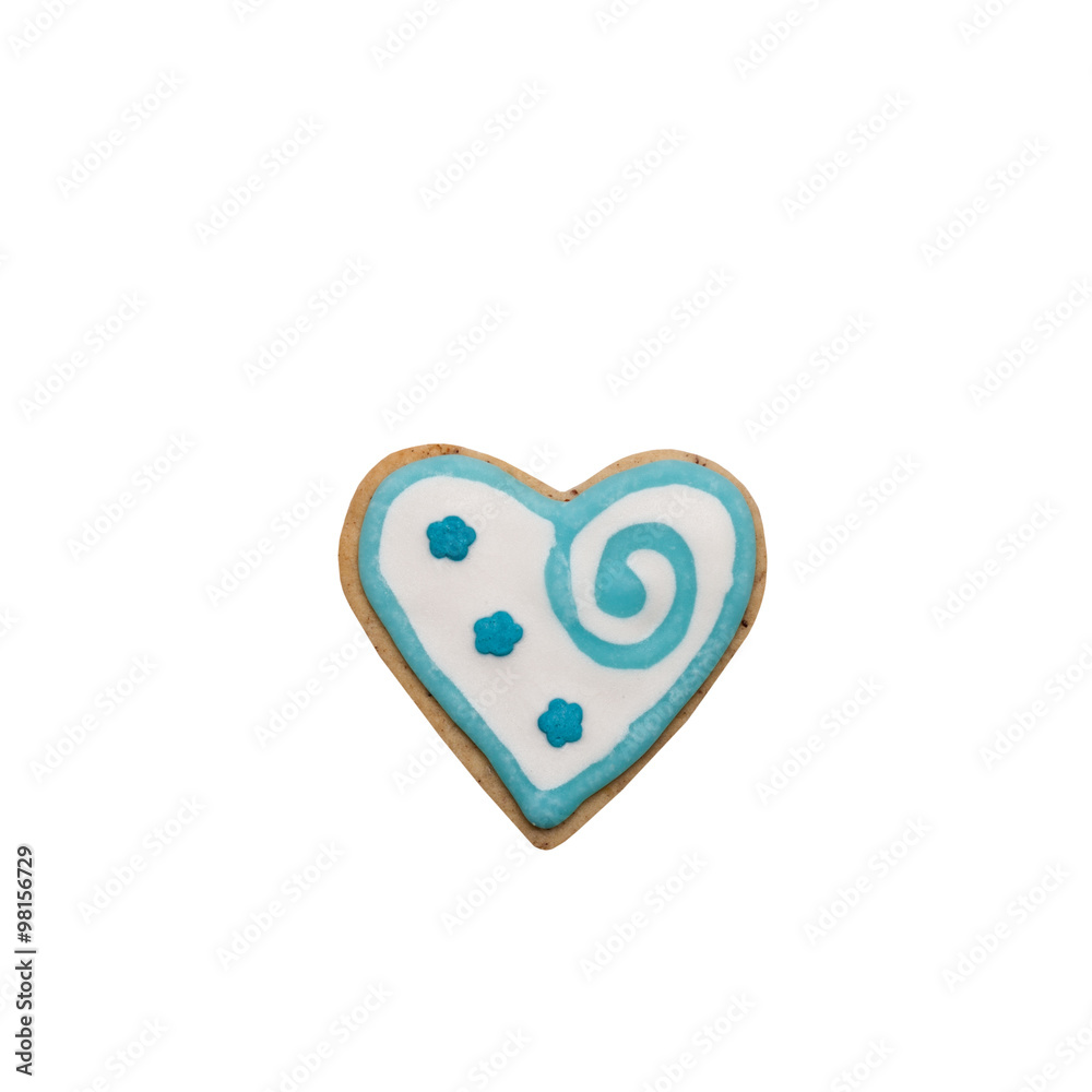 Homemade gingerbread cookie with colored frosting isolated on a Homemade gingerbread cookie with colored frosting isolated on a