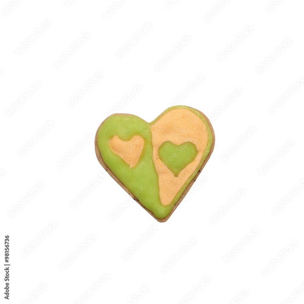 Homemade gingerbread cookie with colored frosting isolated on a Homemade gingerbread cookie with colored frosting isolated on a