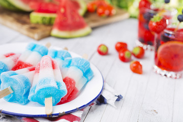 Red-white-and-blue popsicles on an outdoor table
