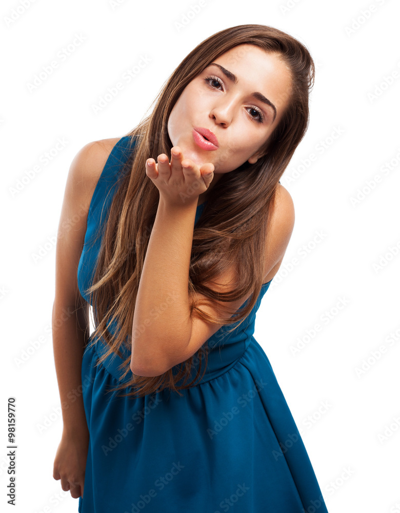 young woman wearing a dress and sending a kiss on white young woman wearing a dress and sending a kiss on white
