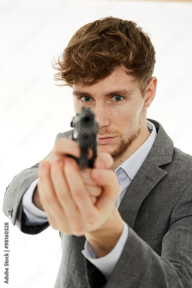 Closeup of a young man with a gun Closeup of a young man with a gun