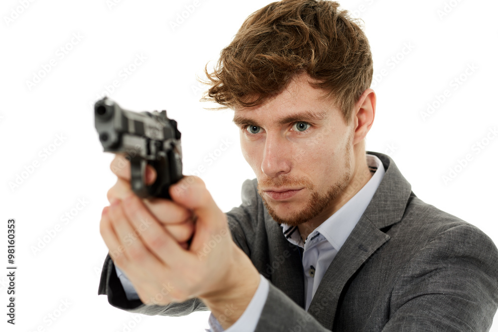 Closeup of a young man with a gun Closeup of a young man with a gun