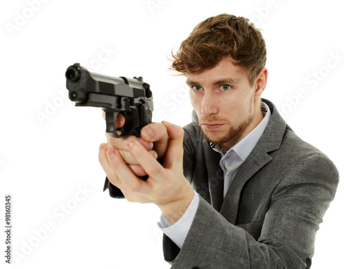 Closeup of a young man with a gun