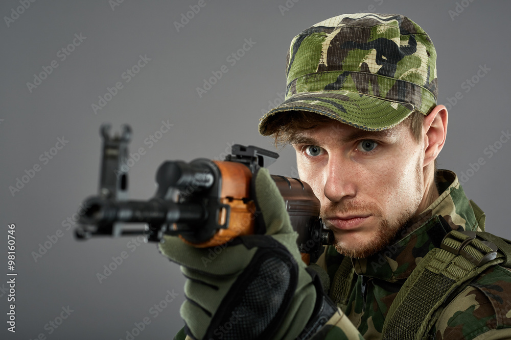 Soldier with machine gun aiming Soldier with machine gun aiming