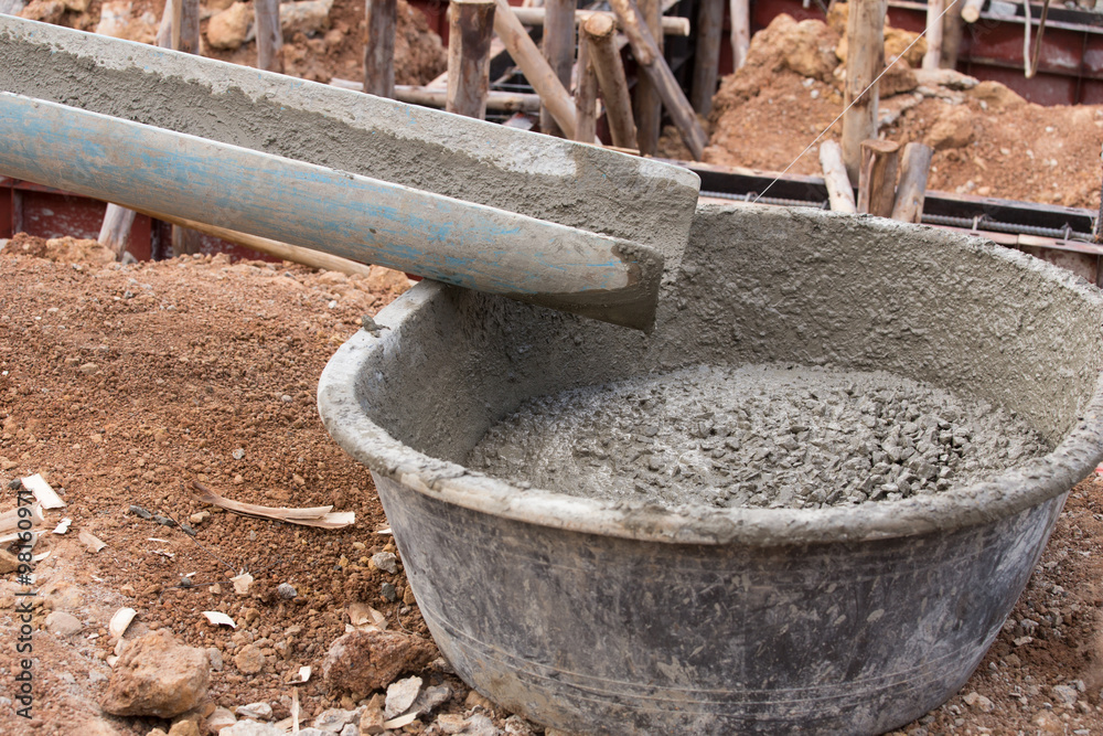 mixed concrete pouring at construction site mixed concrete pouring at construction site