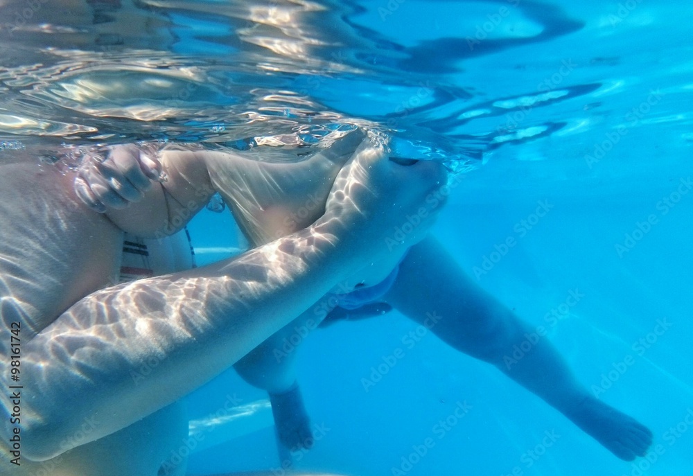 Naklejka premium mother with child swimming