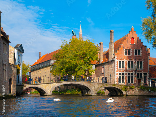 Water canal with old bridge and medieval houses of Bruges