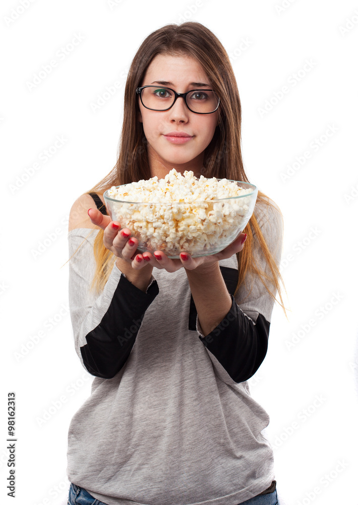 young woman holding a popcorn bowl isolated young woman holding a popcorn bowl isolated