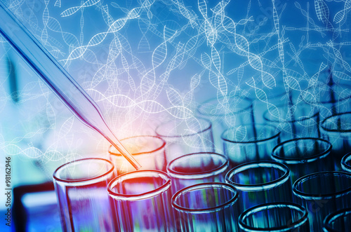 science laboratory test tubes with DNA sign background
