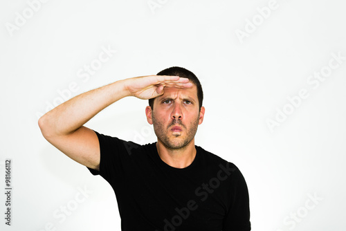 closeup of a young serious man looking ahead - isolated on white background