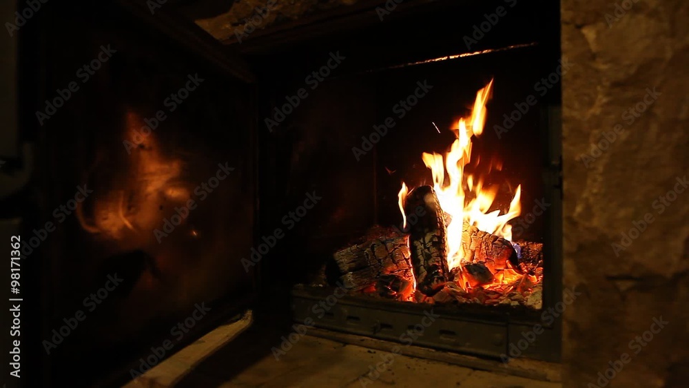 Wood logs fire burn in fireplace, romantic atmosphere Wood logs fire burn in fireplace, romantic atmosphere