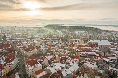 Winter panorama of medieval town within fortified wall. Top view from "Daniel" tower. Nordlingen, Bavaria, Germany. 