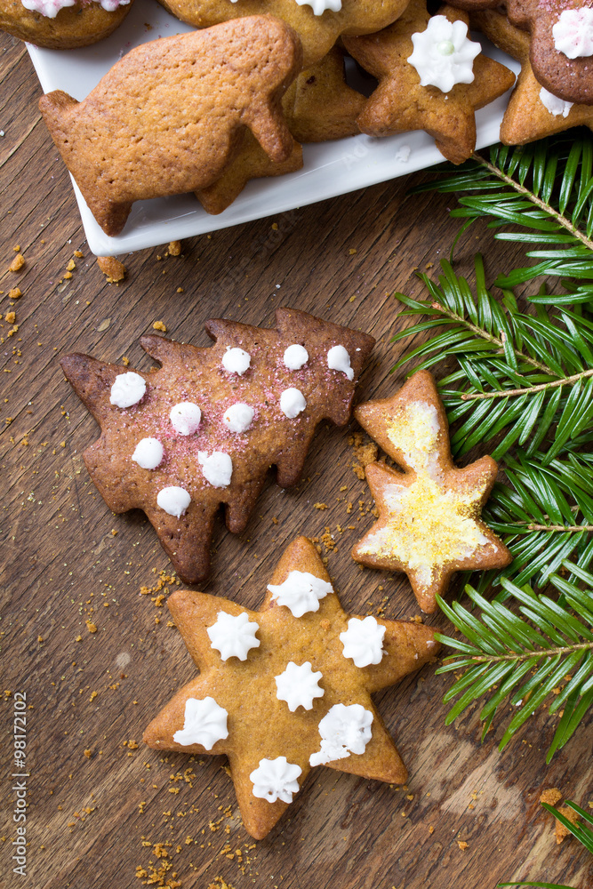 Colorful Christmas gingerbread cookies on wooden background Colorful Christmas gingerbread cookies on wooden background