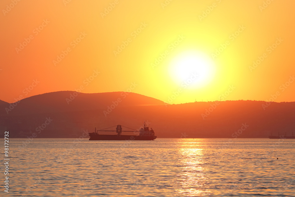 Silhouette of a sea vessel at evening light