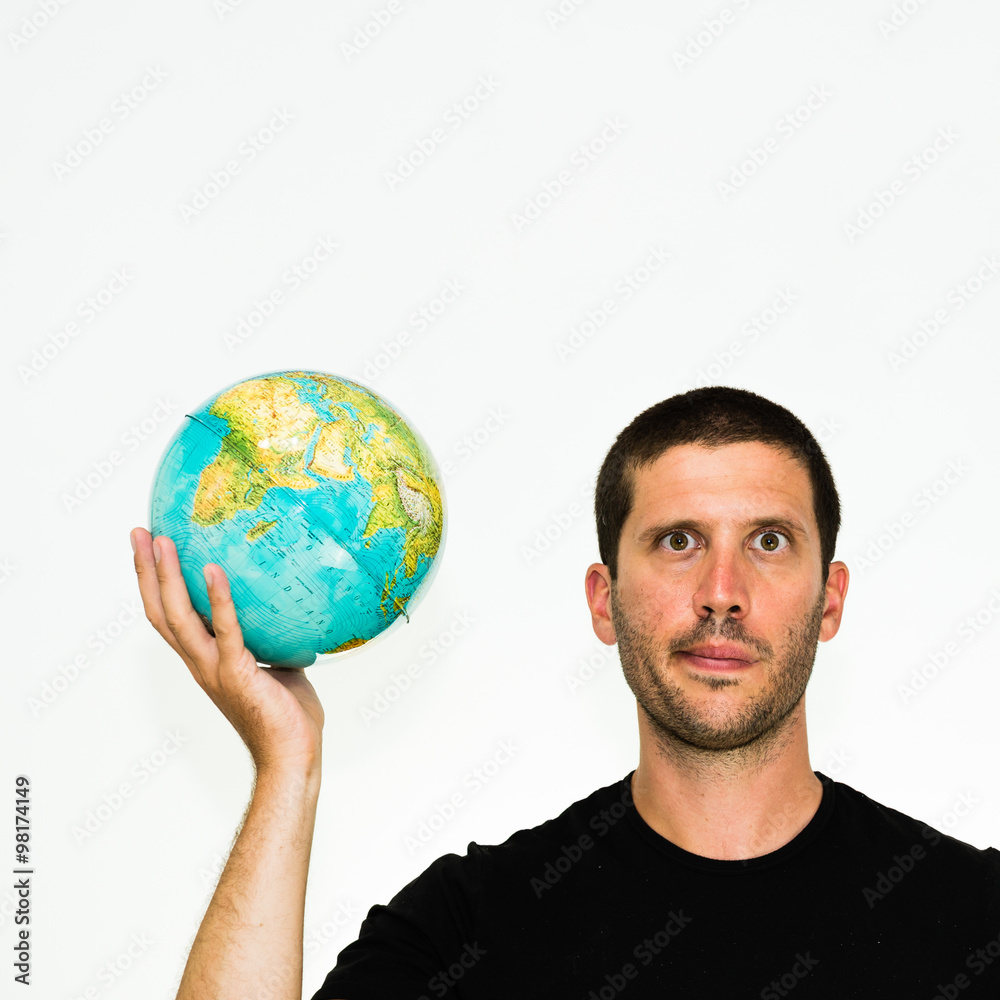 close-up of disheartened caucasian man holding a world globe in his hand with funny expression - conceptual image isolated on white background with copyspace close-up of disheartened caucasian man holding a world globe in his hand with funny expression - conceptual image isolated on white background with copyspace