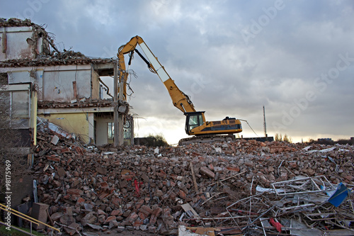Construction Site Excavator Dismantling a Building