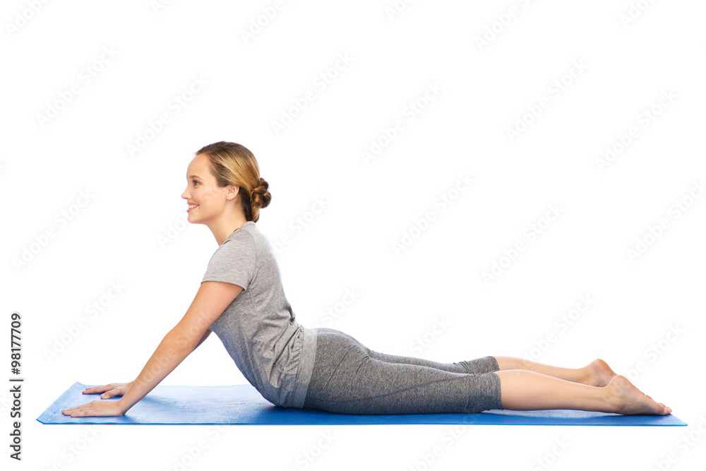 woman making yoga in dog pose on mat