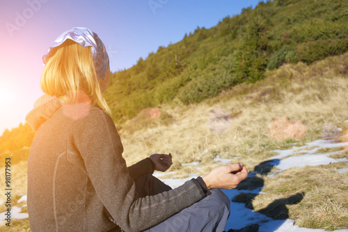 The girl is engaged in nature.