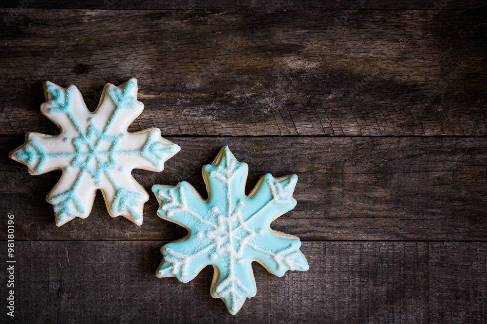 Snowflake cookies on wooden background