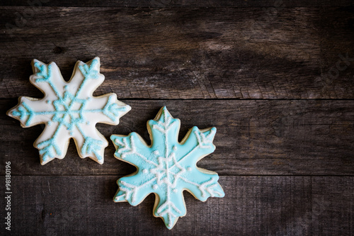 Snowflake cookies on wooden background