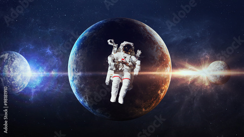 Astronaut in outer space against the backdrop of the planet. Elements of this image furnished by NASA