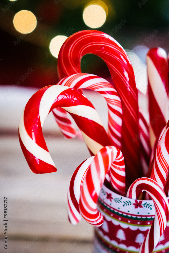 Christmas candy canes on wooden background