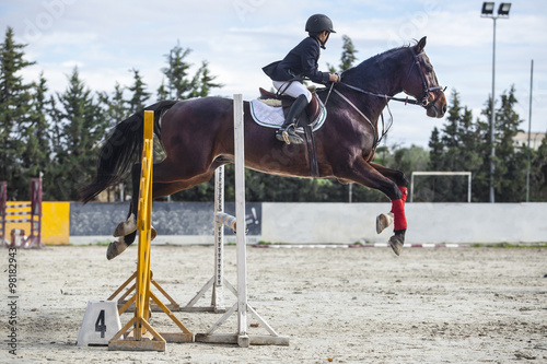 Young Rider jumping with horse