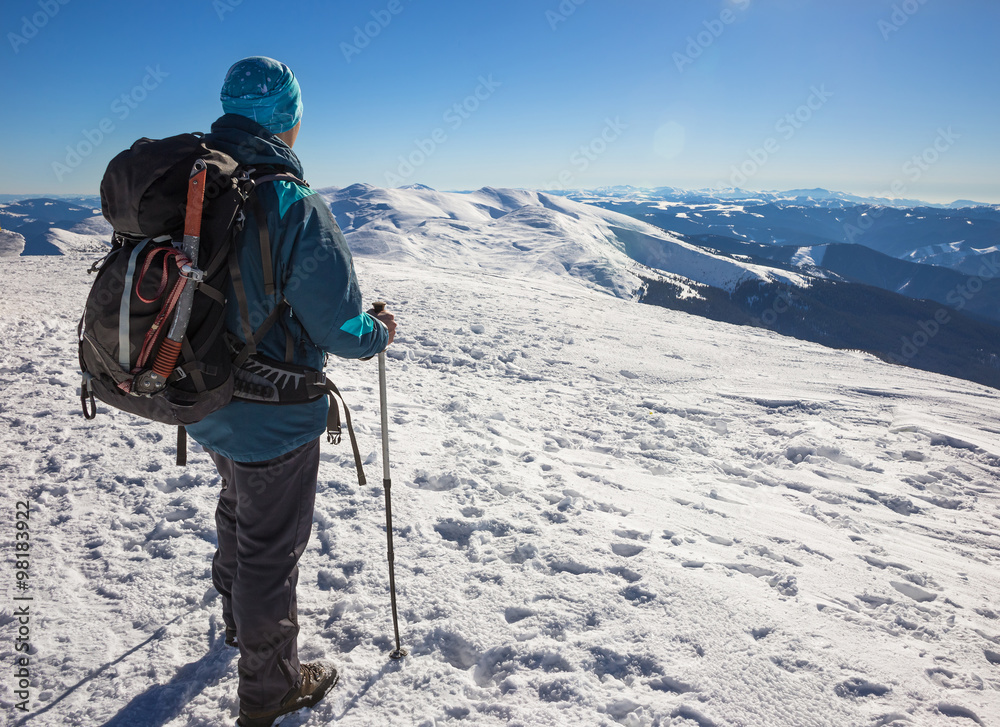 Happy young man hiking on mountain in winter Happy young man hiking on mountain in winter