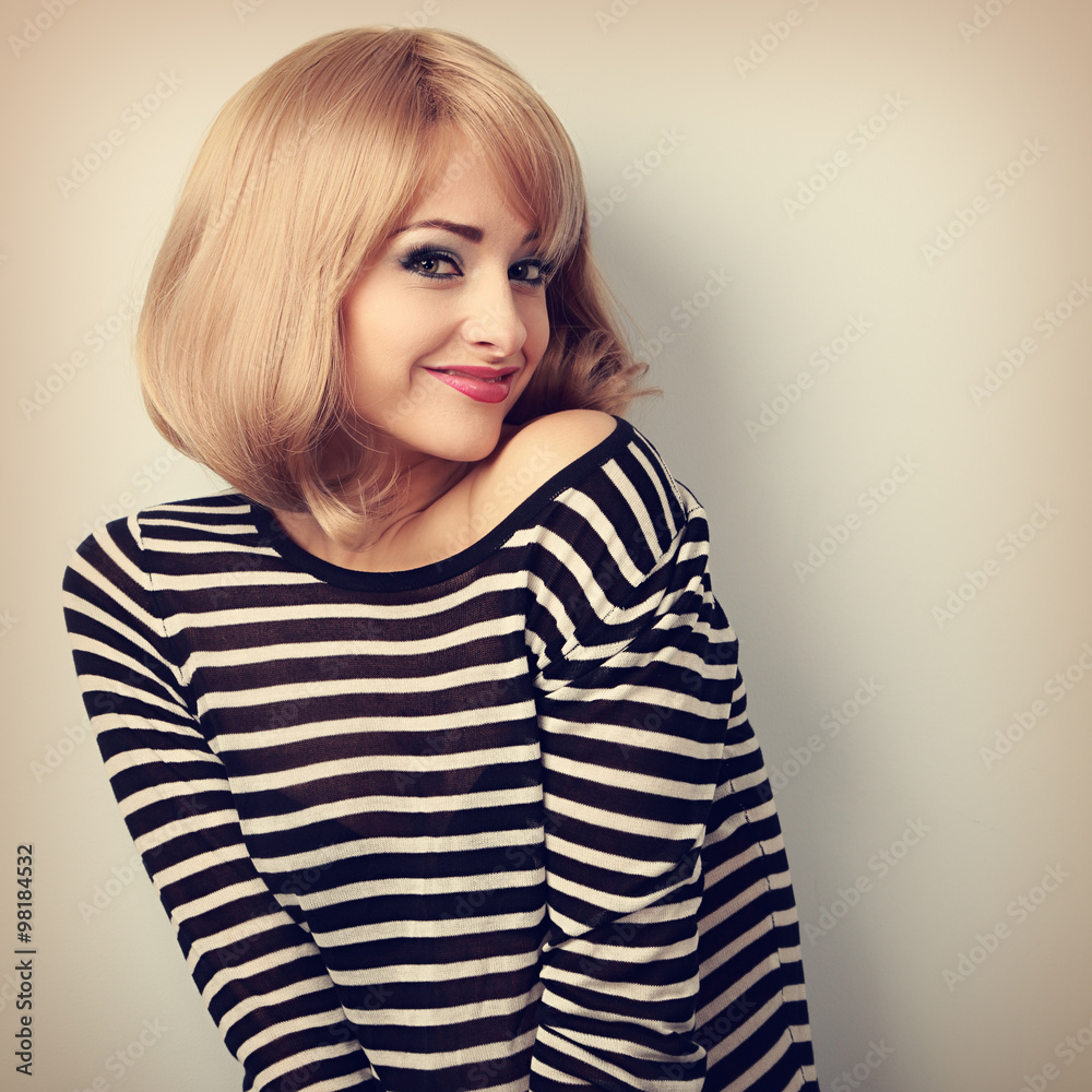 Beautiful happy blond woman with short hair style posing and loo Beautiful happy blond woman with short hair style posing and loo