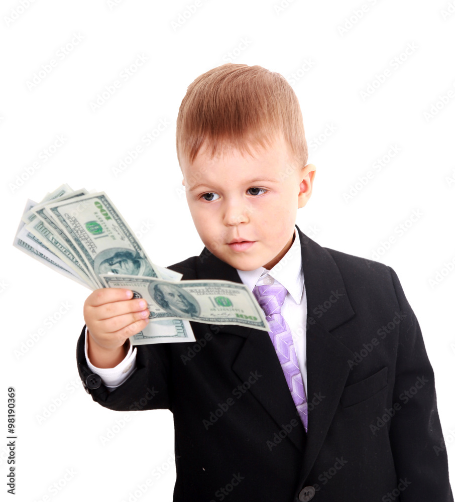 Portrait of a cheerful little boy holding a dollars over white background