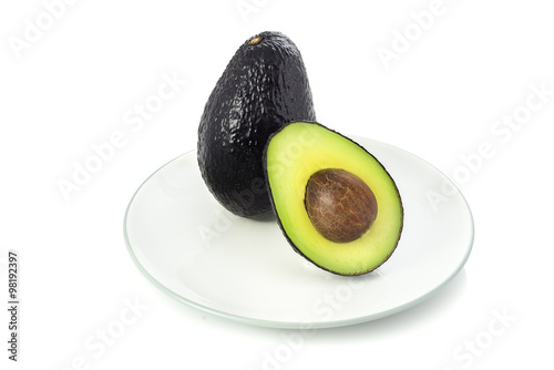 Full and half cut avocado.
