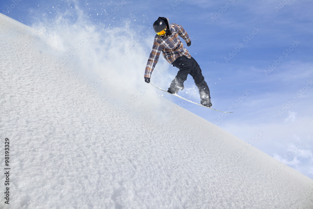 Flying snowboarder on mountains. Extreme sport.