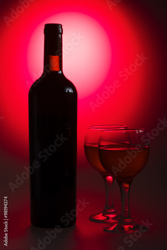 Bottle of wine with glass
