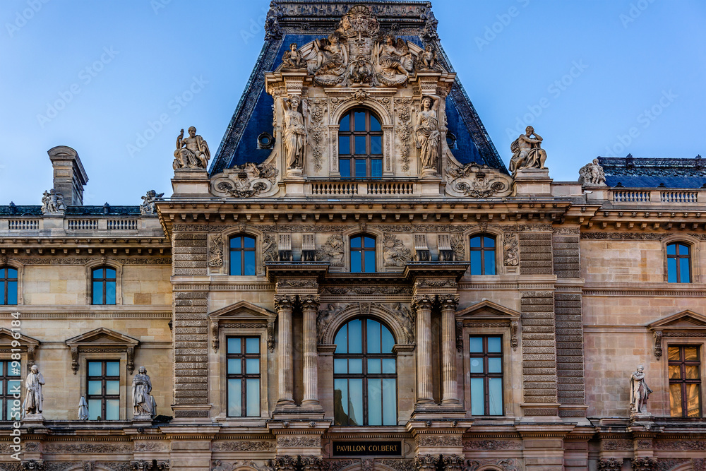 Fototapeta premium Louvre building at courtyard of Louvre Museum at sunset. Paris.