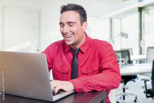 Man smiling in an office 